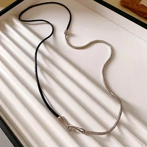 Punk style necklace with black leather cord and silver metal snake chain choker