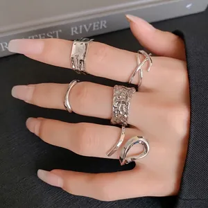 Elegant silver irregular geometric open rings set featuring hammered texture and modern style