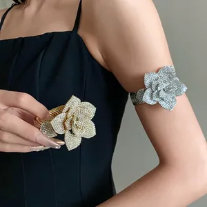 Luxurious vintage adjustable arm cuff bracelet featuring a large 3D rhinestone flower design