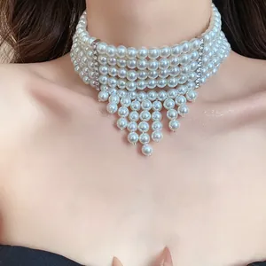 Elegant five-layer pearl choker necklace with sparkling rhinestone tassel detail