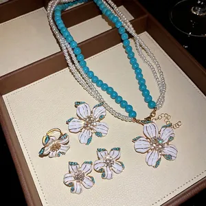 Vintage enamel flower jewelry set with pearls and turquoise beads necklace and earrings