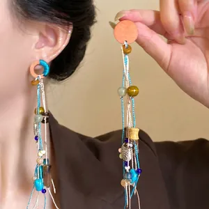 Orecchini pendenti boho vintage con nappe lunghe e perline colorate per le donne