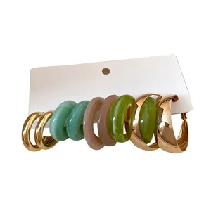 Elegant mixed resin and gold-tone metal hoop earring set with minimalist retro aesthetic