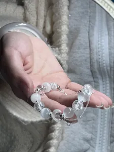Dainty moonstone and crackle quartz bead bracelet with crescent moon charm detail