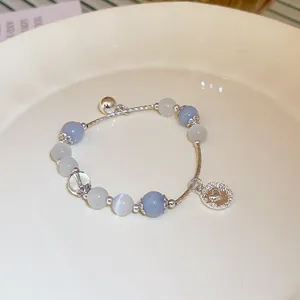 Close-up of elegant crystal beaded bracelet with a silver heart charm detail
