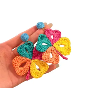 Handmade colorful raffia woven flower earrings for bohemian vacation style accessory