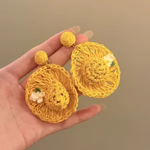 Handmade yellow raffia straw hat drop earrings with white flower details