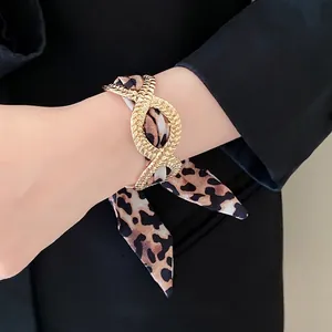 Elegant French style gold alloy bracelet featuring a leopard print silk scarf ribbon detail