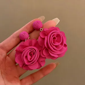 Large fuchsia raffia flower drop earrings with silver needles for seaside vacation.
