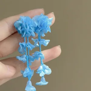 Blue organza flower dangle earrings with beaded tassels, sweet seaside holiday style.
