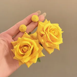 Vibrant yellow raffia flower drop earrings for beach vacations and summer fashion