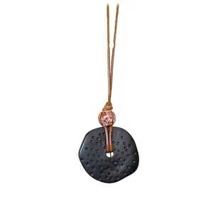 Collana vintage in stile etnico con pendente in resina perla testurizzata e cordino