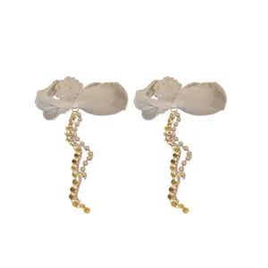 Elegant silver needle flower earrings featuring long pearl and gold bead tassels