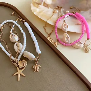 Juego de pulsera y tobillera de cuentas de concha bohemia con dijes de mar