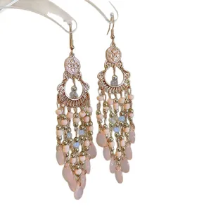 Elegant Bohemian vintage tassel earrings featuring pink rice beads and crystal teardrops