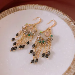 Elegant vintage court style drop earrings featuring colorful crystals and golden chain tassels