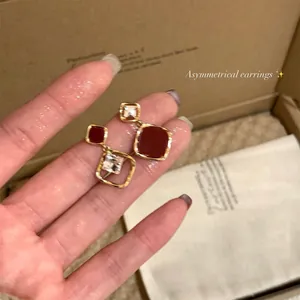 Asymmetrical vintage 18k gold plated earrings with zircon in premium gift box.