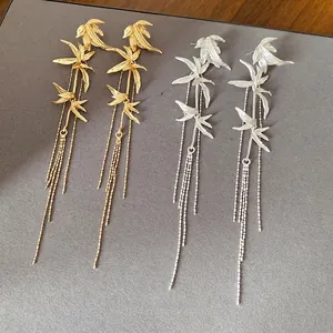 Elegant new Chinese style bamboo leaf tassel earrings available in gold and silver finishes