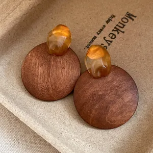 Detailed macro view of vintage Maillard style wooden circular stud earrings set