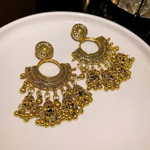 Exquisite vintage gold fan-shaped earrings featuring delicate bell tassels for women