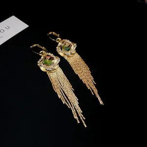 Luxury gold-plated long tassel earrings featuring green zircon and sparkling crystals