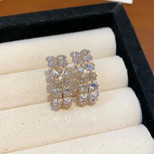 Detailed view of luxury double-row square zircon hoop earrings with gold-plated finish