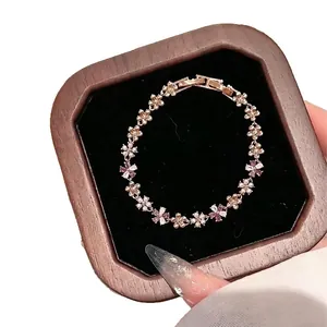 Elegant French-style rose gold bracelet with zircon flowers and pearls in gift box.