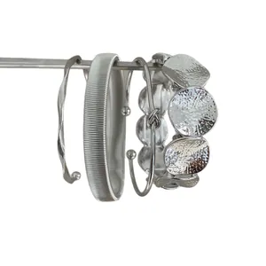 Premium set of four silver vintage metal bracelets with textured and knotted designs.
