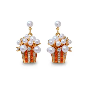 Exquisite popcorn shaped earrings with white pearls and orange zircons in gold plating