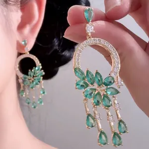 Close-up detail of elegant New Chinese style green crystal flower tassel drop earrings