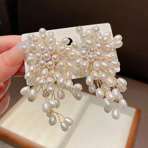 Elegant vintage flower pearl tassel earrings featuring handcrafted gold wire detailing