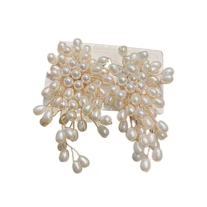 Vintage silver needle earrings featuring elegant pearl flower clusters and long tassels