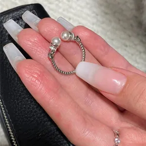Vintage style silver twisted open ring featuring white pearls and zircon accents