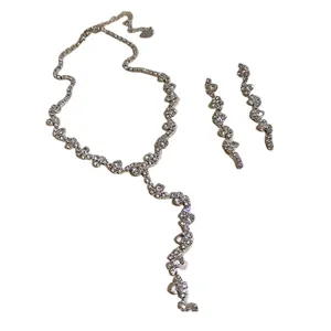 Elegant rhinestone tassel jewelry set including necklace and matching earrings