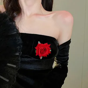 Elegant red rose hair clip pinned on black velvet dress, trendy Korean floral hair accessory