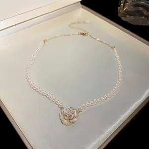 Elegant French vintage necklace with artificial pearls and white camellia flower pendant
