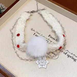 Elegant Christmas snowflake necklace with white pom-pom and pearl accents for winter