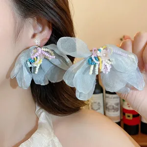 Elegant silver needle earrings with glass beaded chiffon flower design for vacation.