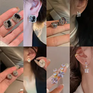 Detailed view of various elegant silver cubic zirconia stud and drop earrings for women