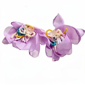Elegant lavender chiffon flower earrings with handcrafted glass bead centers and silver posts.