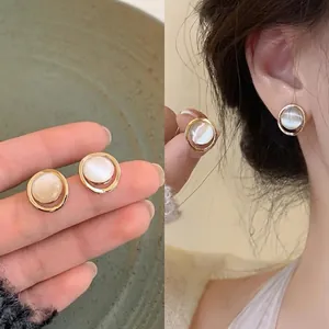 Elegant silver needle stud earrings with round cat's eye stone inlay