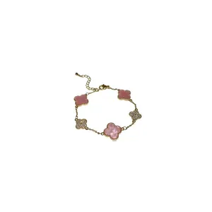 Elegant gold clover bracelet featuring pink charms and shimmering white zircons for women.