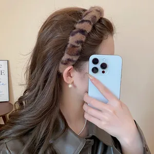Close-up view of a plush leopard print headband for an elegant Maillard autumn style