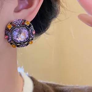 Elegant vintage palace style square earrings featuring purple and amber crystals
