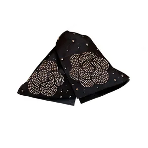 Black fabric claw clips with rhinestone camellia flower pattern for elegant hair styling