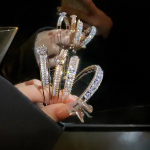 Sparkling luxury zircon water drop double-layer open bracelet shown in elegant hand