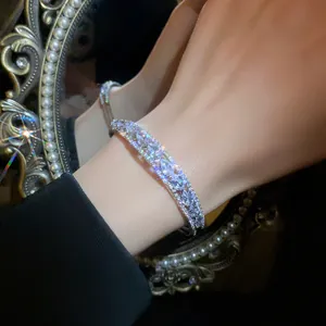 Detailed view of luxury double-layer zircon open bangle with marquise crystals