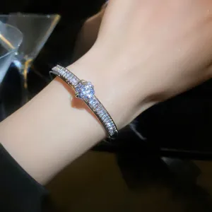 Detail shot of sparkling cubic zirconia bangle on wrist showing exquisite craftsmanship