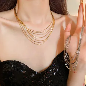 Detailed close-up of a multi-layer gold and silver plated clavicle chain necklace