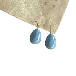 Elegant light blue teardrop oil-dripped hook earrings with a minimalist golden finish